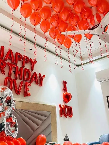 A close-up of the "Happy Birthday Love" and "I Love You" foil balloons, which are key elements in our romantic decoration packages.