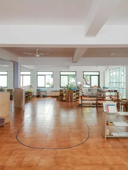 Another view of our spacious environment, showing how the layout allows for both individual work on mats and group activities.