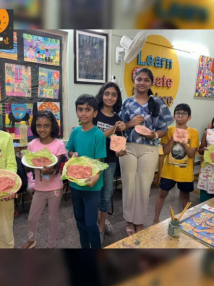 Our "Art Around the World" summer camp students proudly present their clay creations inspired by the Indus Valley civilization.