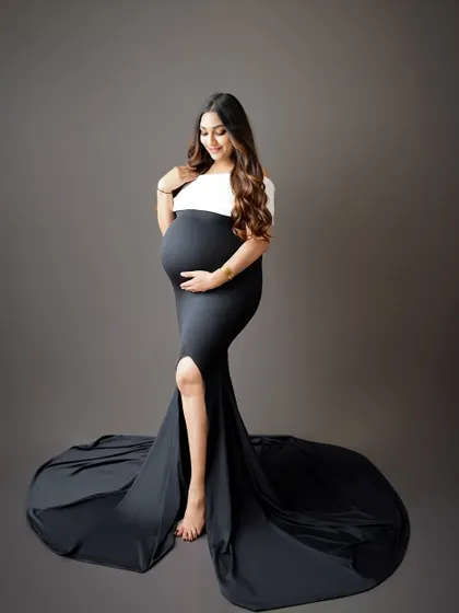 A chic and modern black and white gown creates a stunning and unique silhouette. This portrait is for the fashion-forward mama.