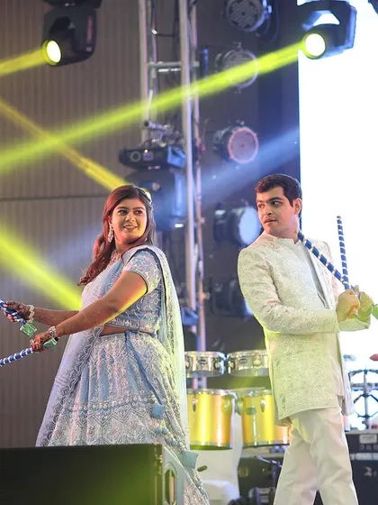 The couple enjoying a moment on stage during their Dandiya night. I help coordinate everything from their outfits to the on-stage programming for a flawless event.