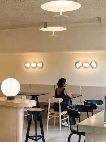 The seating area with its mix of custom furniture and soft, ambient lighting.