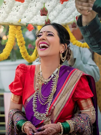 A candid shot of the bride's infectious laughter during her wedding ceremony. These are the moments that truly define the day.