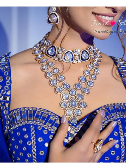 I love playing with colour. This bold Polki necklace set against a vibrant royal blue lehenga is a perfect example of how to create a show-stopping look for your Sangeet or cocktail night. The large, uncut stones make a statement while the design remains elegant.
