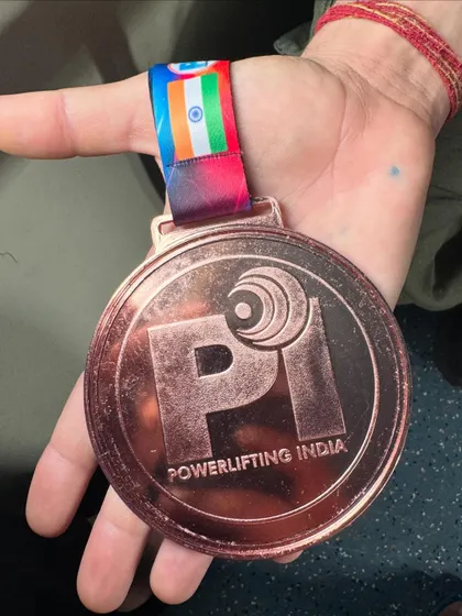 A close up of the bronze medal won by my student Sonia Dhaka in her very first Junior National Powerlifting Championship, lifting a total of 432.5 kg.