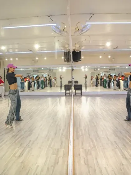 A mirror shot of Mekhola Bose leading her waacking workshop during our Launch Weekend.