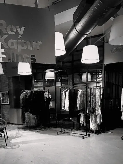 A black and white shot of the costume racks being prepped for a film. This is my office, where all the looks are organized and ready for the actors.