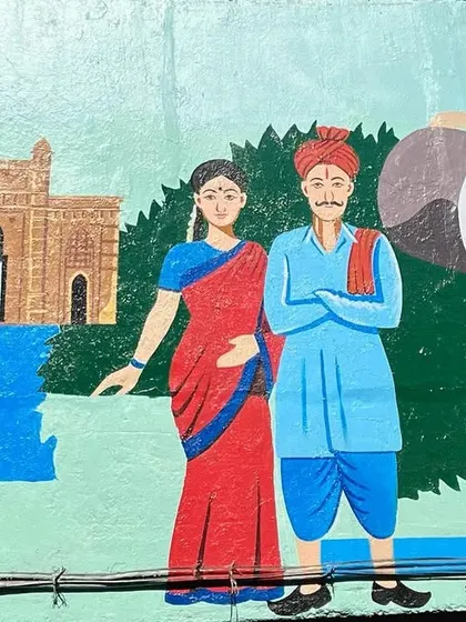 A mural in Dadar showing a Koli couple, representing the original fishing community of Mumbai, with the Gateway of India in the background.