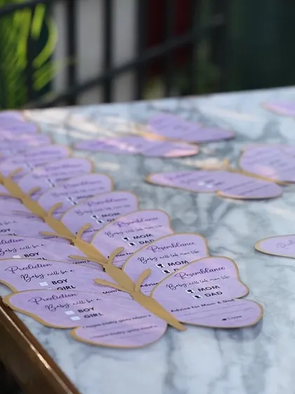 A table of butterfly wish cards, ready for guests to share their love.