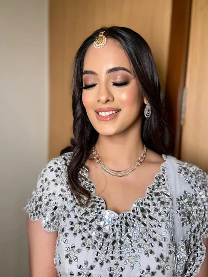 A close-up of the soft smokey eye, created with a blend of neutral brown and taupe shades for a universally flattering look.