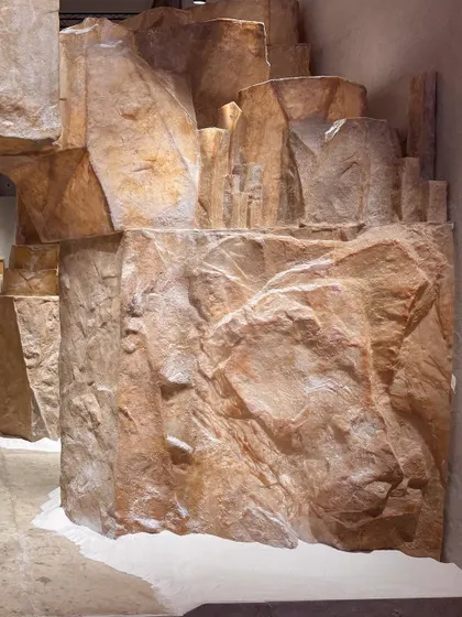 The 'Salt' installation features imposing, rock-like structures made from the biomaterial. The forms are designed to evoke a natural salt cave, demonstrating the material's potential for creating large-scale, immersive environments.