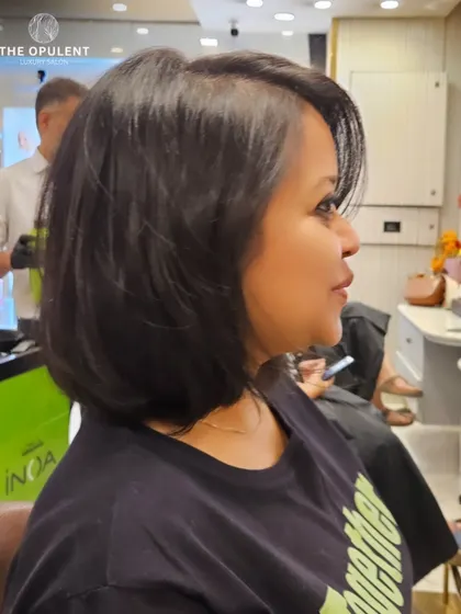 A fresh haircut for a fresh start. This classic bob with subtle layers is timeless, chic, and easy to maintain, giving her an instant boost of confidence.