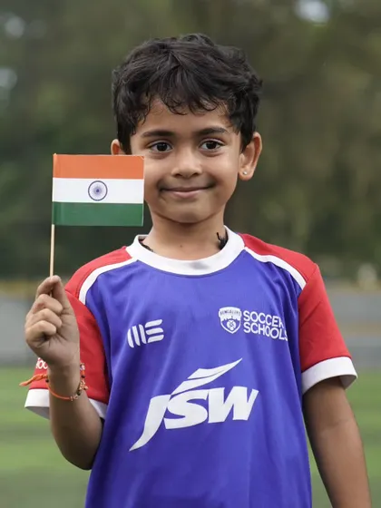 Pride in our hearts and smiles on our faces. A young player celebrates Independence Day at our training center.