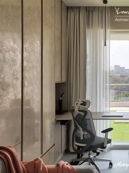 A compact study nook integrated into a bedroom. The adjustable desk and ergonomic chair provide a functional workspace without taking up too much room, and the view of the valley is a bonus.
