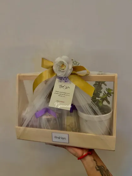 Another angle of the elegant wedding hamper, showing the beautiful wrapping and personalized tag. It's a thoughtful gift that guests will truly appreciate.