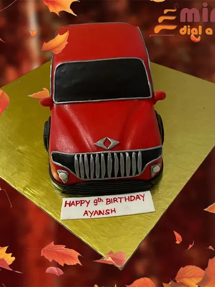 A sculpted red SUV cake, perfect for a car-loving 9-year-old. This 3D cake showcases my ability to create realistic vehicle shapes entirely out of cake.