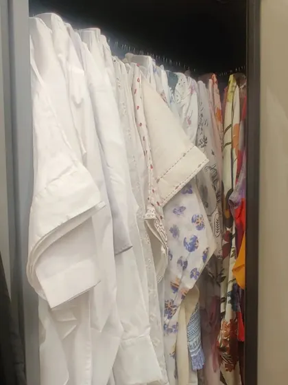 A well-organized hanging section is the backbone of a functional closet. Here, shirts are neatly hung, making them easy to see and grab, preventing wrinkles and saving time in the morning.
