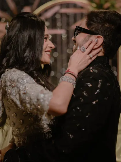 A beautiful, candid shot of the couple lost in their own world. The genuine smiles and eye contact show their super fun and cute chemistry.