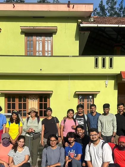 A group photo in front of a cozy homestay. Our stays are an important part of the experience, offering comfort after a long day's trek.