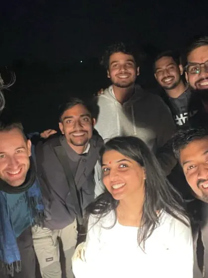A happy group selfie around the campfire. The smiles say it all. Our trips are designed to bring people together.