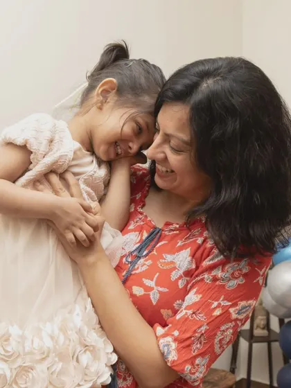 A quiet, loving moment between a mother and her daughter amidst the party fun. I look for these connections to provide a balanced gallery of both high-energy and tender memories.