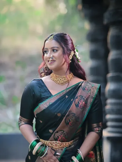 Another angle of this traditional look, showing the beautiful embroidery on the saree and the soft, natural-looking makeup.