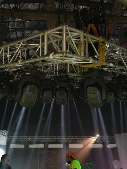 A low-angle shot of the overhead truss for the 'Po Po' song, showing the density of Claypaky Mythos fixtures used to create the powerful effects.