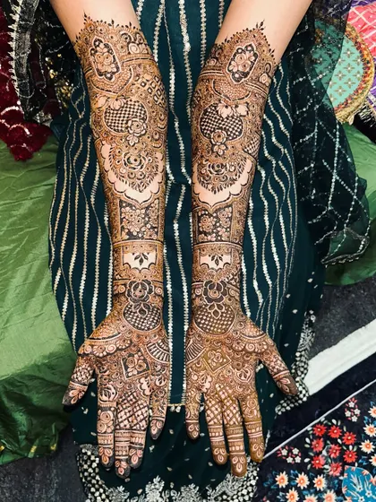 A classic bridal design featuring a mix of geometric and floral patterns. The coverage is full and the details are incredibly fine.
