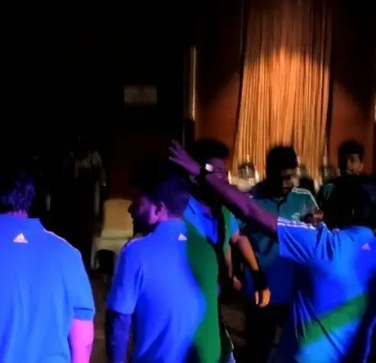 A corporate event with a focus on Kannada music, with employees enjoying the local flavor.