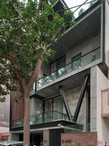 Another view of the Paschim Vihar project, showing how the cantilevered balconies and large glass panels create a sense of lightness and transparency.