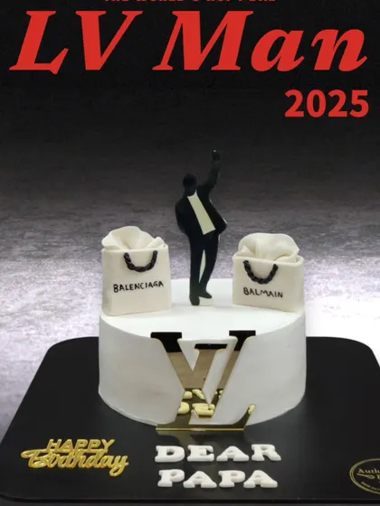 A stylish LV Man cake for a fashion-forward dad. This cake features the iconic Louis Vuitton logo and miniature shopping bags from Balenciaga and Balmain.