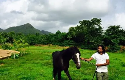 My journey has always been connected to the beautiful earth. A peaceful moment with a horse at a stud farm, surrounded by the green hills of the Western Ghats.