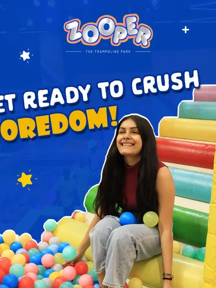 Get ready to crush boredom. A young visitor enjoys her time in the ball pit, one of the many fun activities I offer for all ages.
