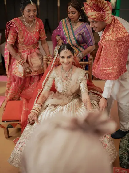 A joyful moment as the bride is carried to the mandap by her family members.