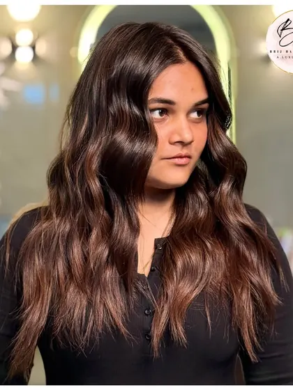 Your hair is your crown, and this look is pure magic. A beautiful brown color with soft waves that radiate confidence and a fearless sparkle.