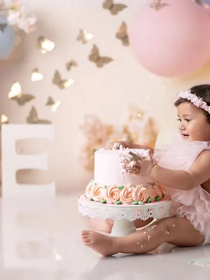 A side view of this little princess enjoying her butterfly cake. The pastel colors are so soft and pretty.