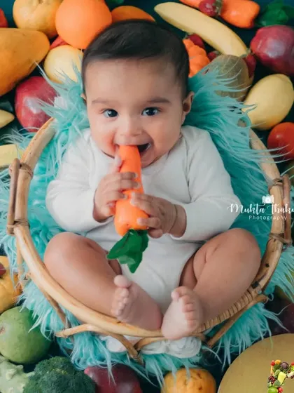 That happy face says it all. This 5-month-old loved his healthy and colorful photoshoot.