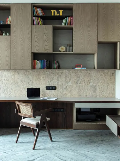 The younger daughter's lounge is designed for fun and relaxation, with a large 'gadda-bed' for sleepovers, a study table with a cork backsplash, and ample book storage.