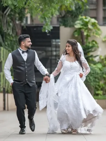 A fun, candid shot of the couple running and laughing together. This captures their playful side and the happiness of the day.