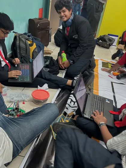 This is what competition prep looks like: pure chaos and intense focus. Our mentor with the teams, working on the floor, debugging code, and making sure everything is ready for the big moment.