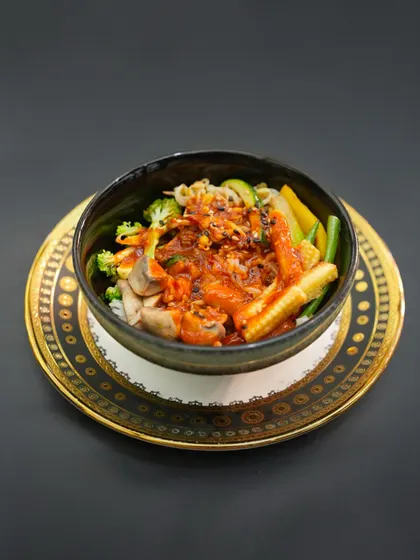 A Korean classic, perfected for our vegetarian menu. Our Kimchi Bokkeumbap, or kimchi fried rice, is a flavourful bowl of spicy, tangy, and savoury goodness, topped with fresh vegetables.