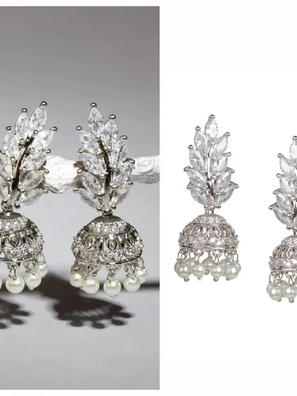 Can you believe these are just 6 grams? These silver-toned jhumkas are embedded with sparkling stones and finished with pearls, offering a touch of glamour in a very lightweight design.