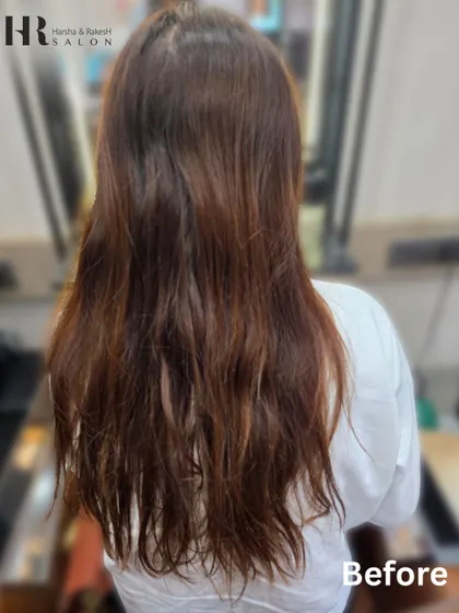 The starting point for the burgundy transformation. Her hair was ready for a refresh, and we achieved a vibrant new look.