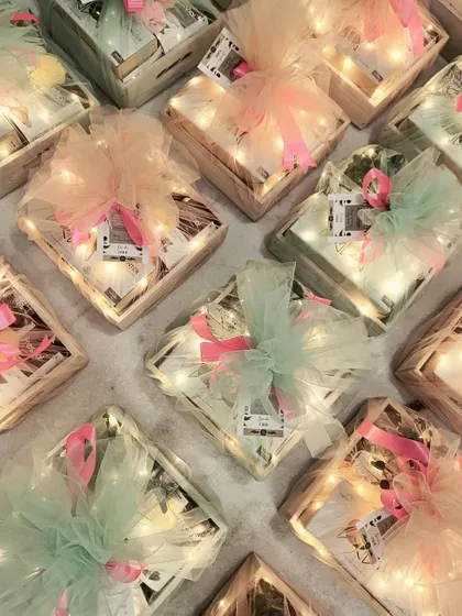 An overhead view of our pastel-themed Diwali hampers, each uniquely wrapped and ready to be gifted.
