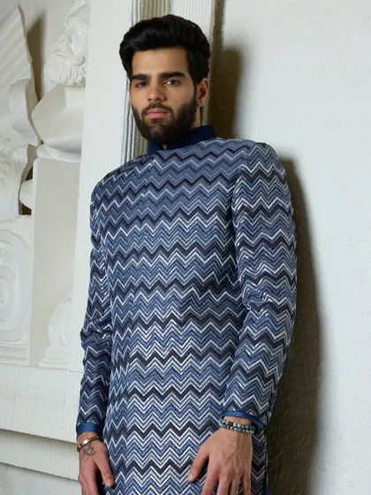 The intricate chevron weave of this kurta is captured in detail here. The rich textures and heritage-inspired silhouette make this a truly special garment.
