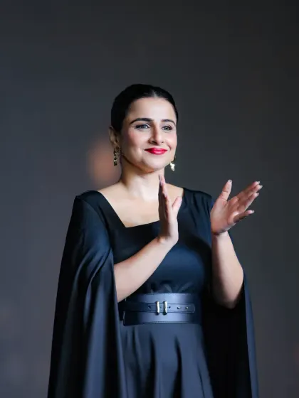 A candid moment of applause from actress Vidya Balan. This shot captures the positive and celebratory atmosphere of the awards ceremony, adding a touch of warmth and authenticity to the event's documentation.