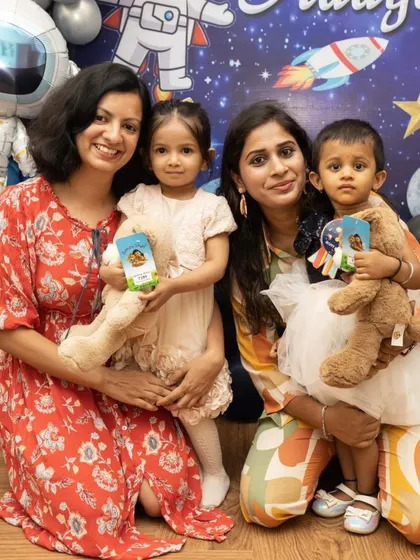 A group photo of mothers and their children at the party. It's important to capture the friends and family who came to celebrate with you.