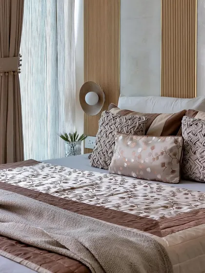 This series showcases different serene bedroom styles. From the bold red headboard with mirrored wardrobes to the calming green Murphy bed, each space is a sanctuary of calming colors and soft textures.