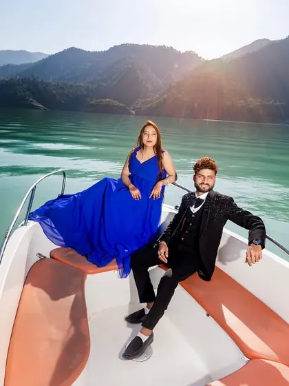 A glamorous pre-wedding shoot on the waters of Tehri lake. I arrange for the speedboat and help you style the perfect look, like this flowing blue gown, to create stunning, high-fashion portraits against the mountain scenery.