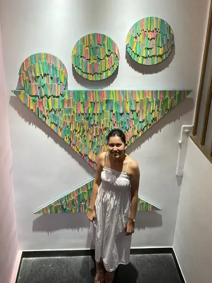 This colorful installation, shaped like a cocktail glass, was a fun project for a commercial space. The layered, painted pieces create a vibrant 3D effect on the wall.